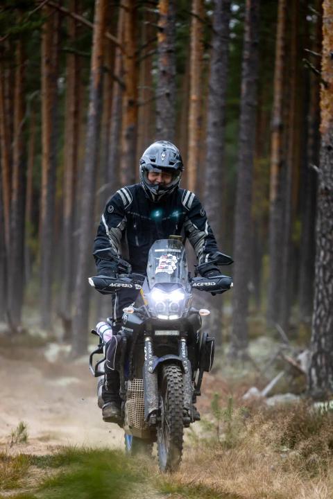 A motorcycle rider travelling along a sandy forest trail – Alakonnu Rally 2025