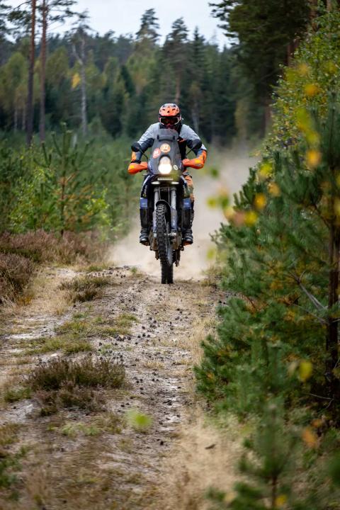 A motorcycle rider travelling along a sandy forest trail – Alakonnu Rally 2025