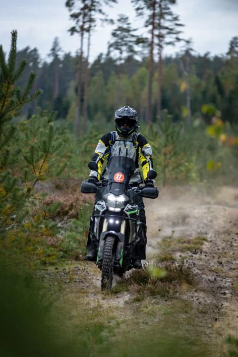 A motorcycle rider travelling along a sandy forest trail – Alakonnu Rally 2025