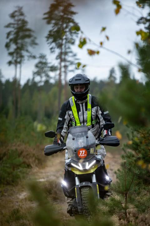 A motorcycle rider travelling along a sandy forest trail – Alakonnu Rally 2025