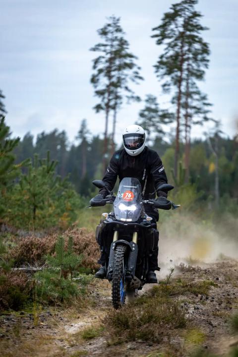 A motorcycle rider travelling along a sandy forest trail – Alakonnu Rally 2025