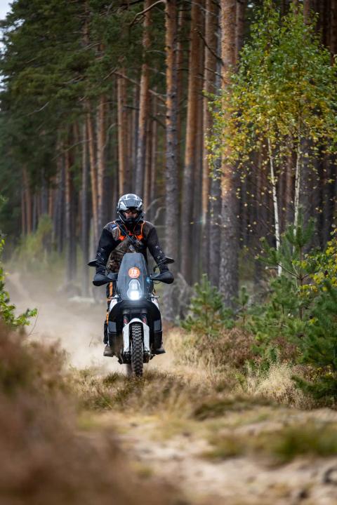 A motorcycle rider travelling along a sandy forest trail – Alakonnu Rally 2025