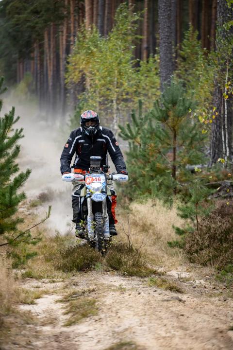 A motorcycle rider travelling along a sandy forest trail – Alakonnu Rally 2025