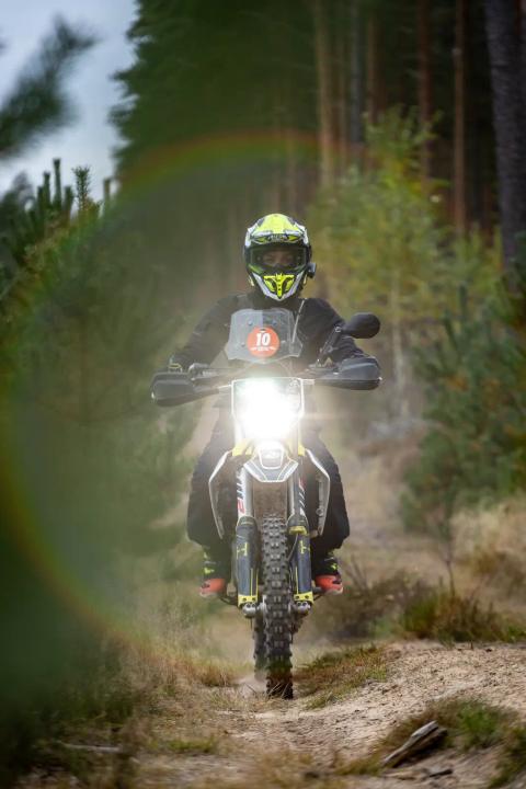 A motorcycle rider travelling along a sandy forest trail – Alakonnu Rally 2025