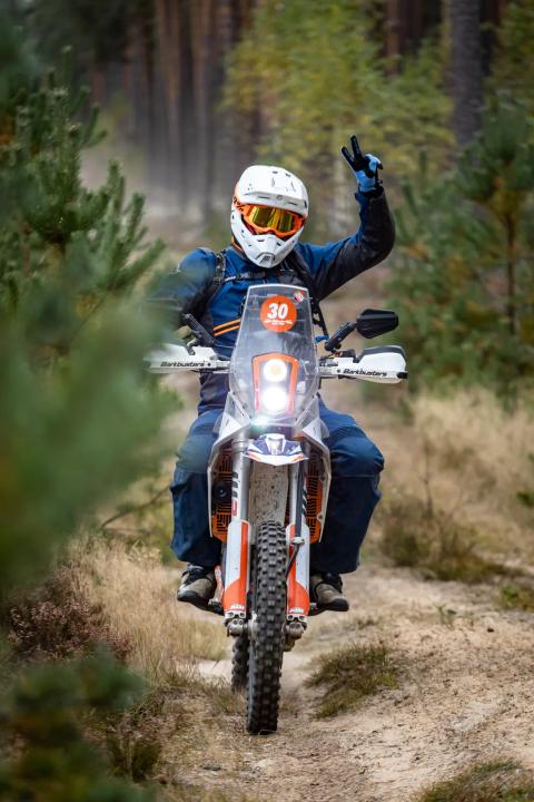 A motorcycle rider travelling along a sandy forest trail – Alakonnu Rally 2025