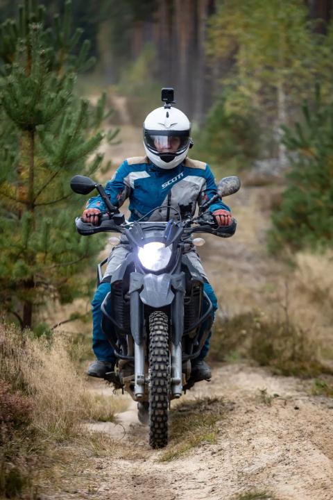 A motorcycle rider travelling along a sandy forest trail – Alakonnu Rally 2025