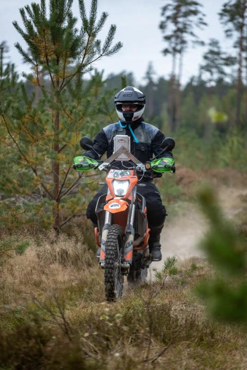 A motorcycle rider travelling along a sandy forest trail – Alakonnu Rally 2025