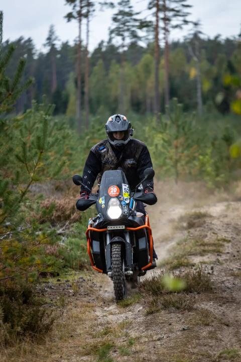 A motorcycle rider travelling along a sandy forest trail – Alakonnu Rally 2025