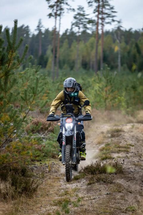 A motorcycle rider travelling along a sandy forest trail – Alakonnu Rally 2025
