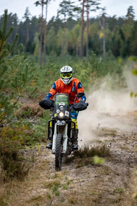 A motorcycle rider travelling along a sandy forest trail – Alakonnu Rally 2025