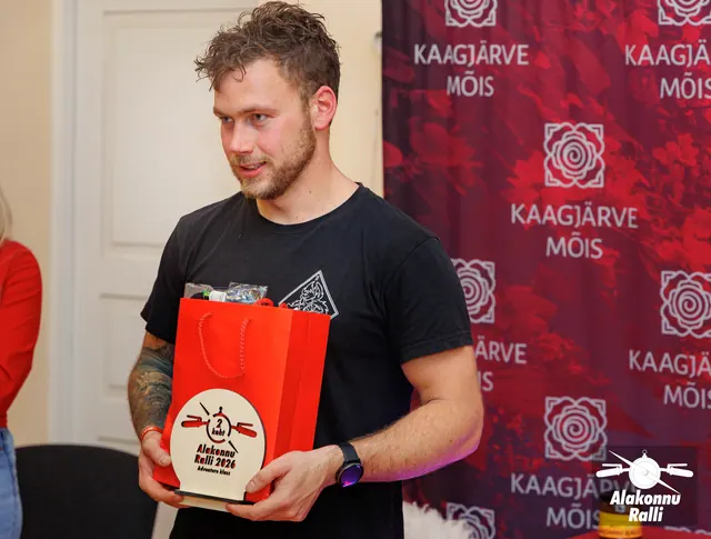 A prize recipient with a trophy at the rally awards ceremony – Alakonnu Rally 2026, Awards ceremony