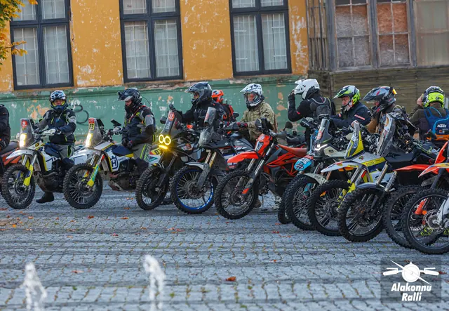 Rally motorcycles lined up on the town square – Alakonnu Rally 2026, SS1