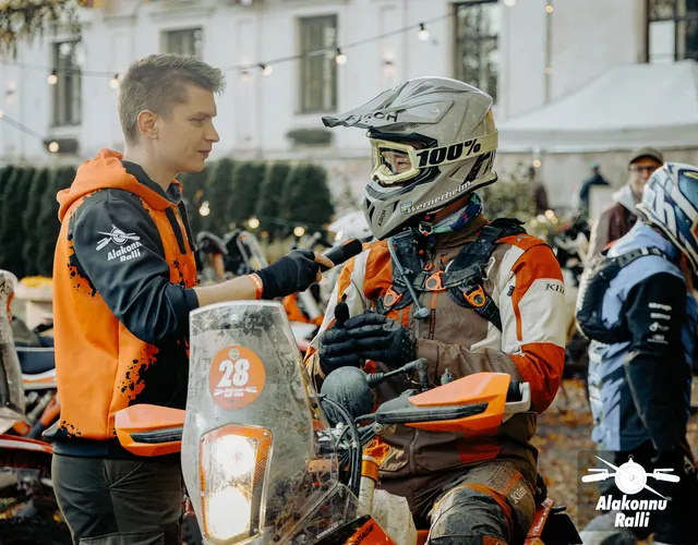 An organizer talking with a motorcycle rider before heading onto the course – Alakonnu Rally 2026, SS2 · SS3