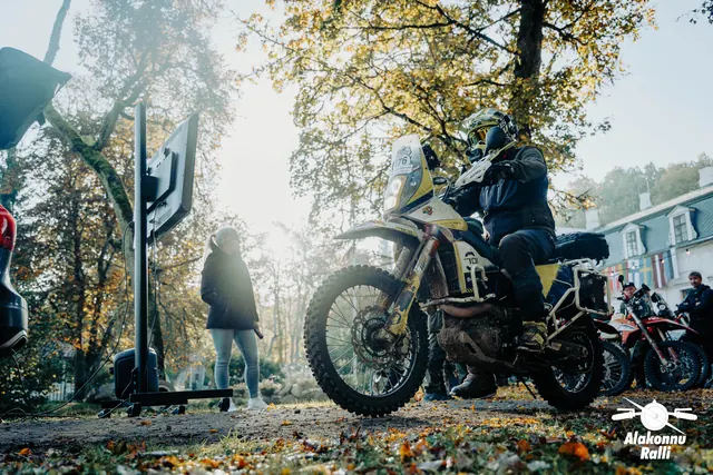 A motorcycle rider at the gathering point beside organizers – Alakonnu Rally 2026, SS2 · SS3
